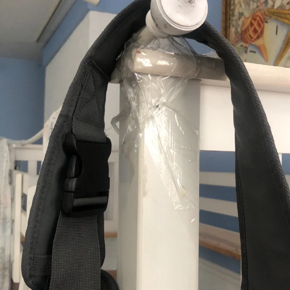 Puppy holder for small dogs. Adjustable straps very convenient
